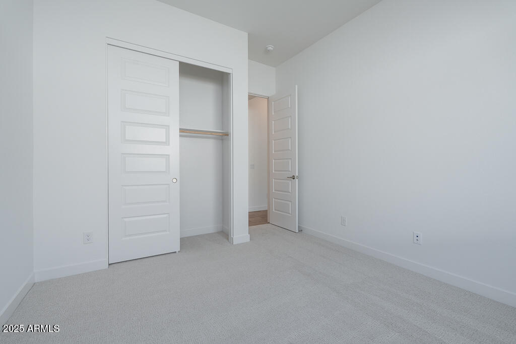 816 Golden Ore Pass Apache Junction, AZ 85120 - Photo 15 of 23 an empty room with closet area