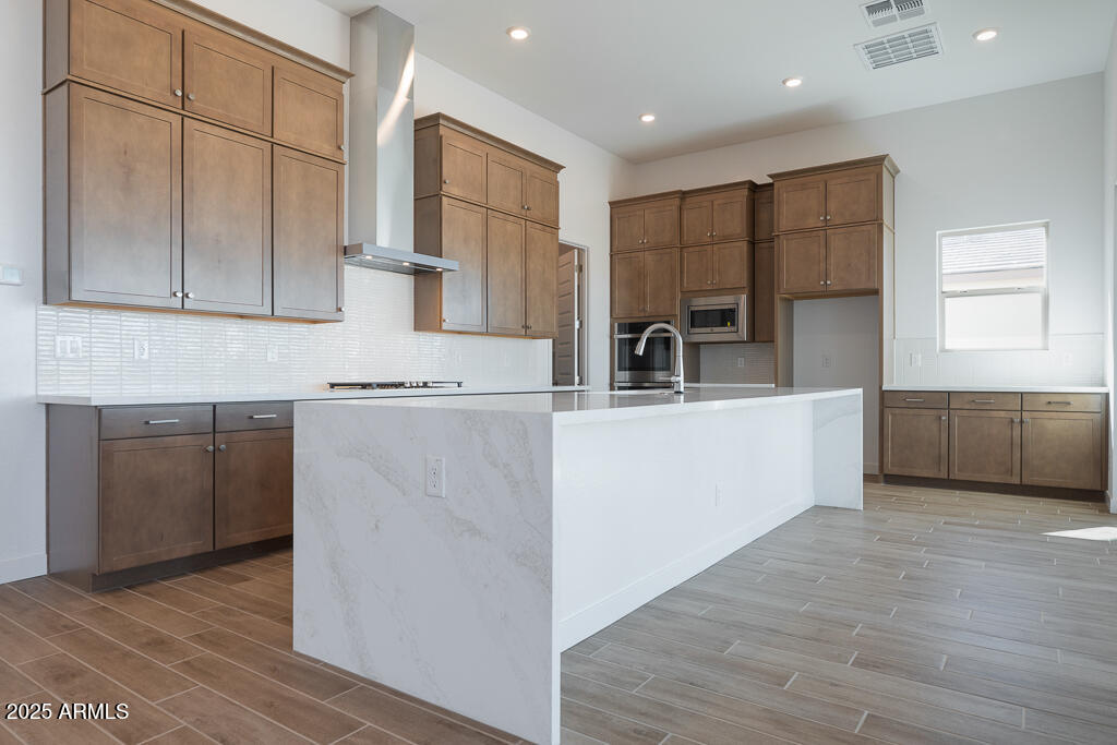 816 Golden Ore Pass Apache Junction, AZ 85120 - Photo 2 of 23 a kitchen with kitchen island granite countertop a sink cabinets and stainless steel appliances