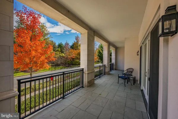 a view of a balcony with chairs