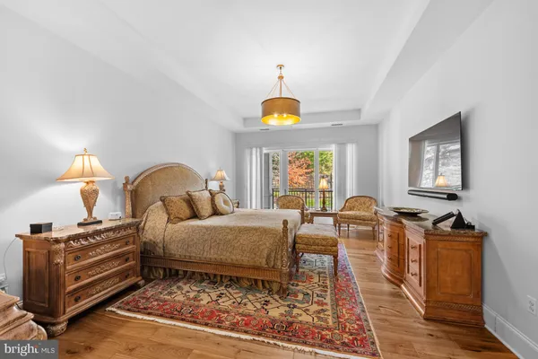 a bed room with a bed and a chandelier