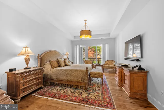 a bed room with a bed and a chandelier