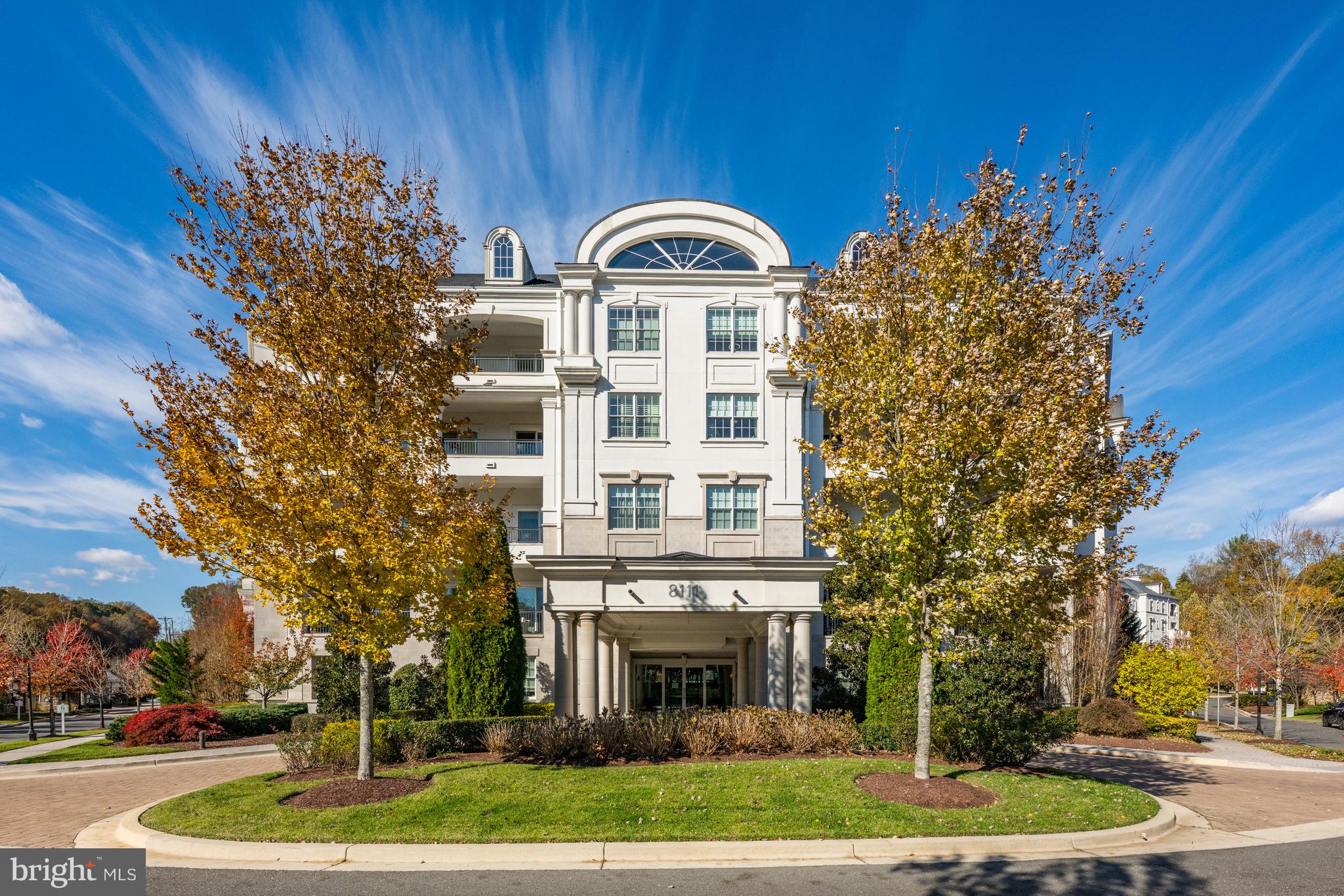 8111 River Road, Unit 116 Bethesda, MD 20817 - Photo 21 of 21 a front view of a house with a garden