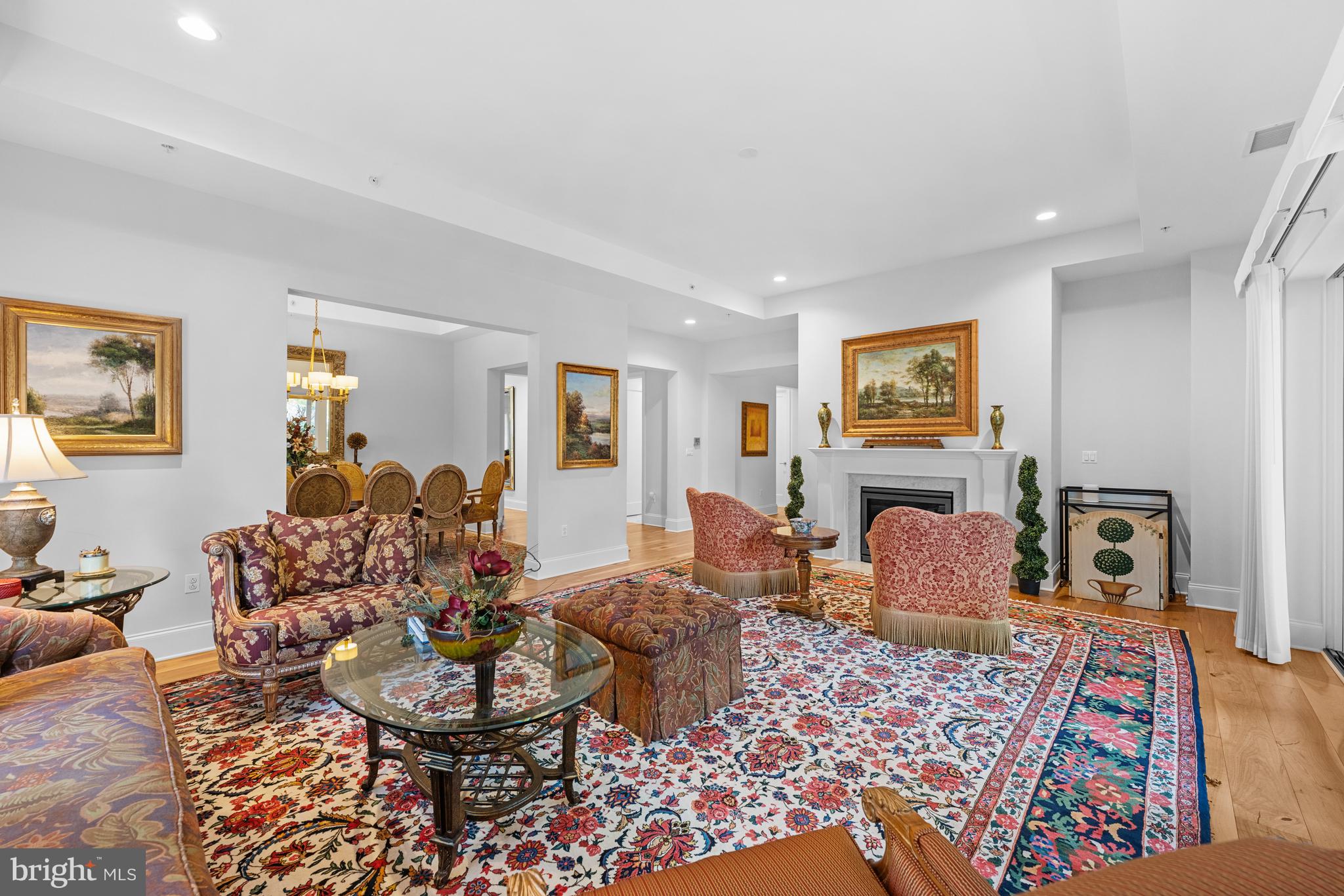8111 River Road, Unit 116 Bethesda, MD 20817 - Photo 4 of 21 a living room with furniture and a flat screen tv