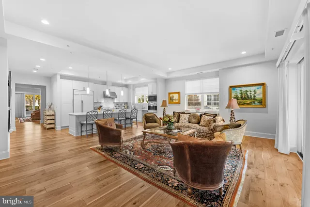 a living room with furniture or wooden floor and a table