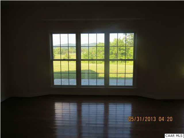 933 Mt Olivet Road Dyke, VA 22935 - Photo 11 of 28 a view of empty room with wooden floor and fan