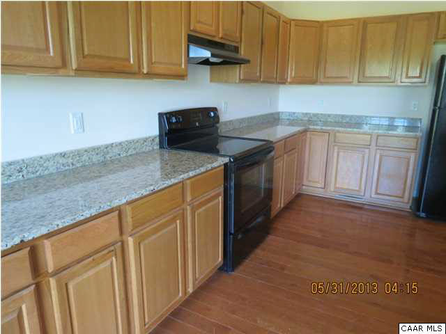 933 Mt Olivet Road Dyke, VA 22935 - Photo 19 of 28 a kitchen with stainless steel appliances granite countertop a sink a stove top oven and cabinets