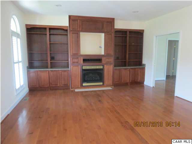 933 Mt Olivet Road Dyke, VA 22935 - Photo 22 of 28 an empty room with a fireplace and window