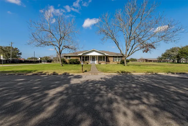 a view of a swimming pool with an outdoor space and seating area