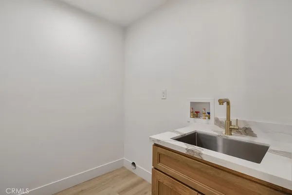 a view of utility room with sink