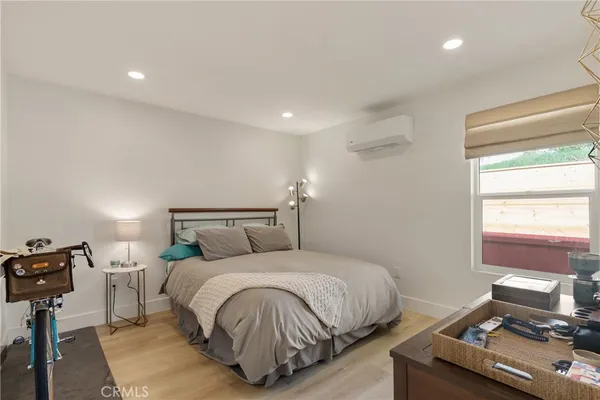 a bedroom with a bed and with furniture