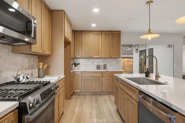 a kitchen with a stove and a sink