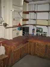 a kitchen with stainless steel appliances kitchen island granite countertop a sink and cabinets