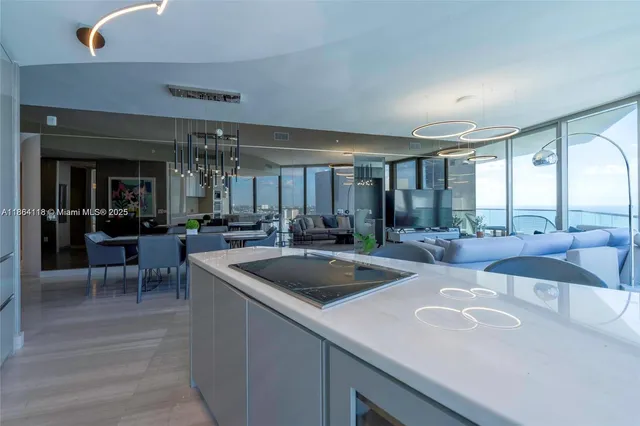 a kitchen with a sink and large window