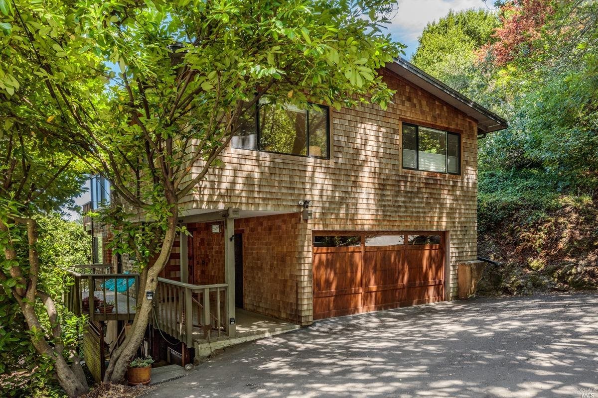 a front view of a house with garage