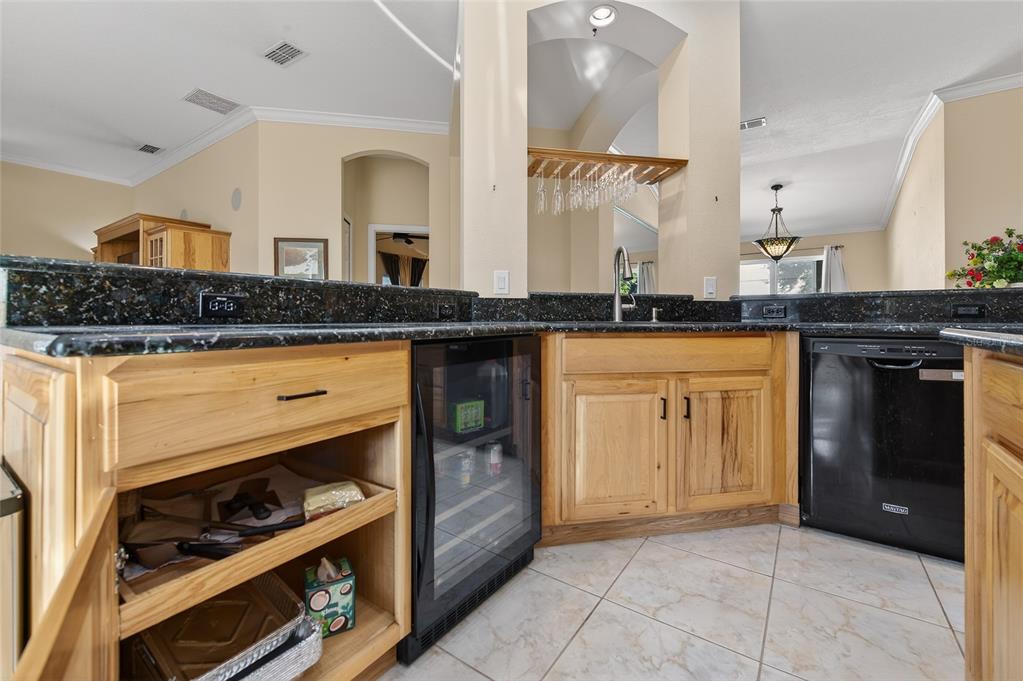 1864 Orange Tree Drive Edgewater, FL 32141 - Photo 16 of 38 a kitchen with granite countertop a stove and a sink