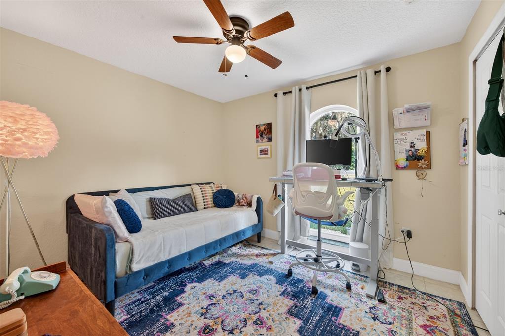1864 Orange Tree Drive Edgewater, FL 32141 - Photo 36 of 38 a living room with furniture and a chandelier