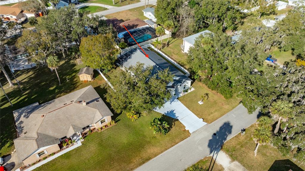 1864 Orange Tree Drive Edgewater, FL 32141 - Photo 6 of 38 an aerial view of a house with a yard and lake view