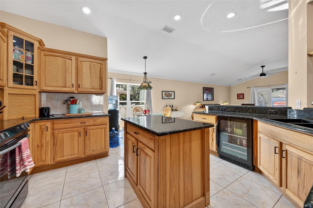 1864 Orange Tree Drive Edgewater, FL 32141 - Photo 10 of 38 a kitchen with granite countertop a sink and cabinets