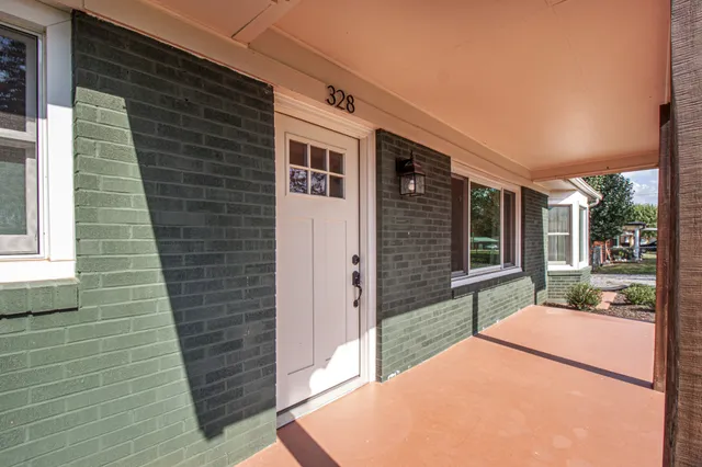 a backyard of a house with outdoor seating