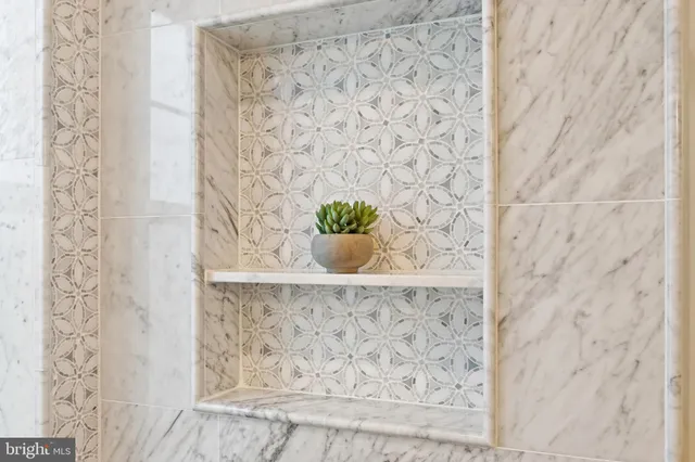 a view of a room with window and a bed