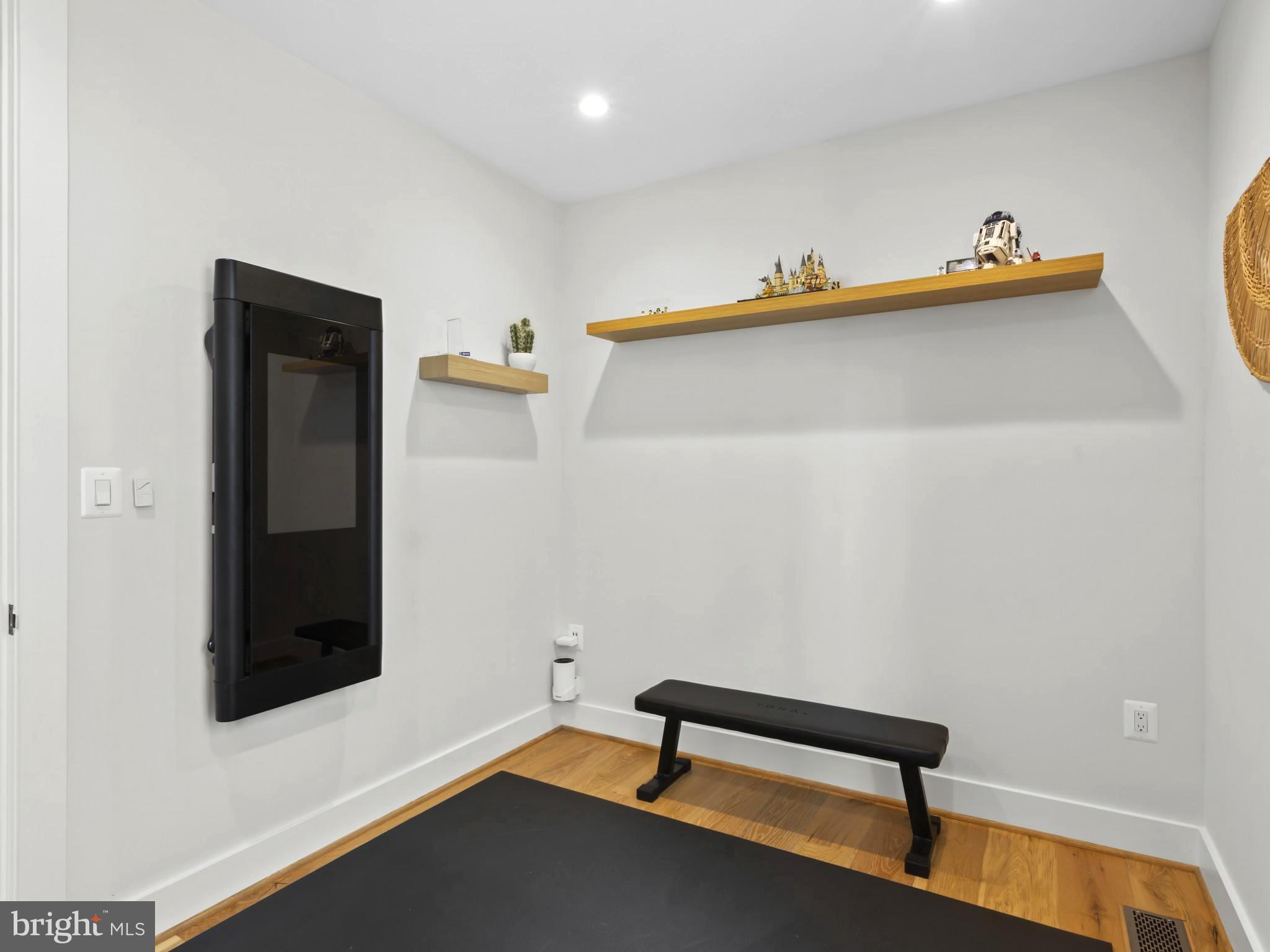 910 8th Street Northeast Washington, DC 20002 - Photo 26 of 54 a view of a hallway with wooden floor and a cabinet