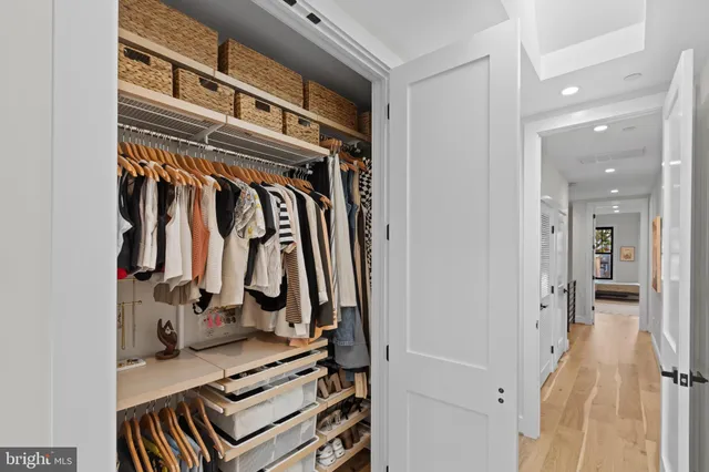a spacious bathroom with a glass shower door and a mirror