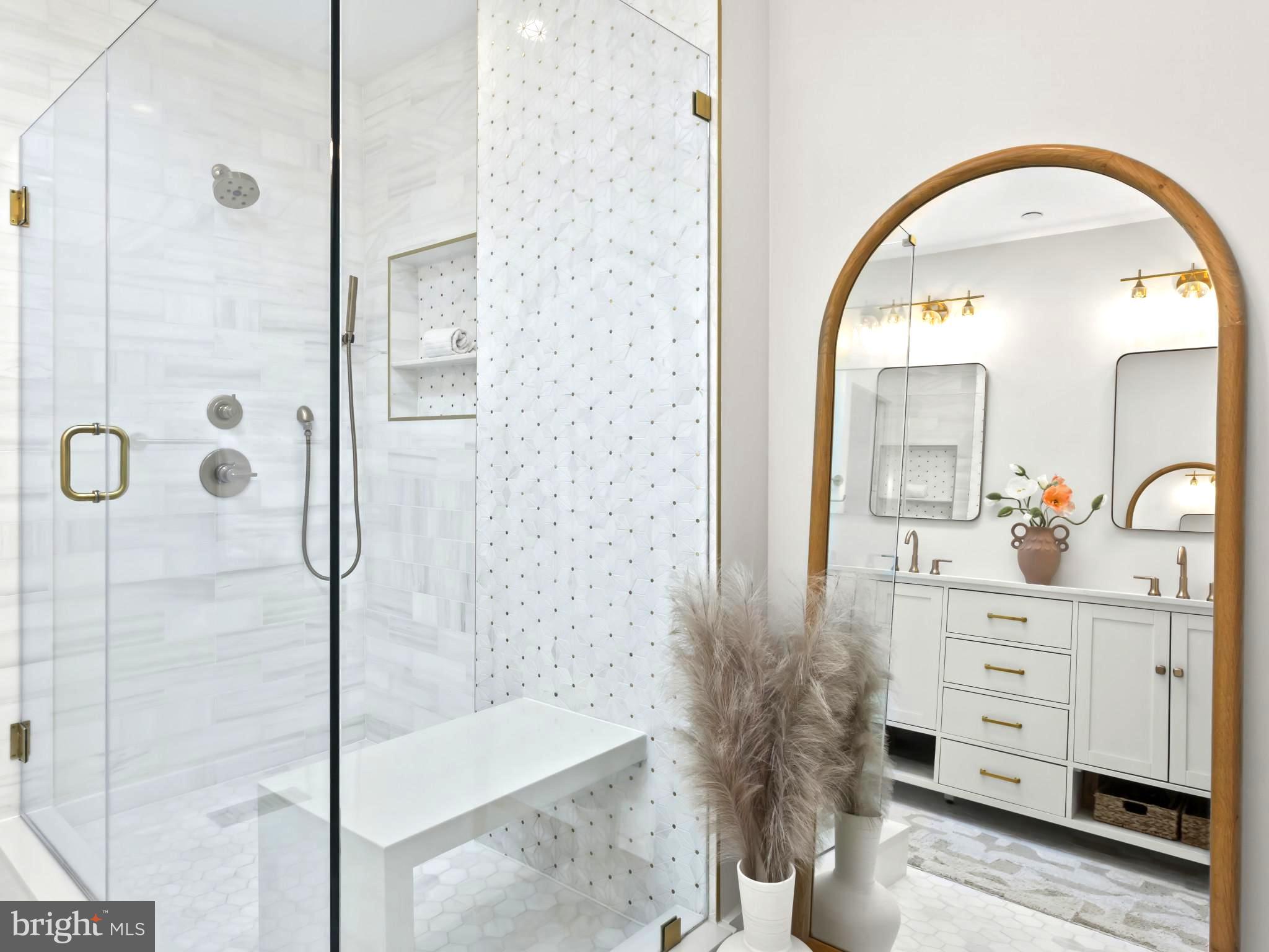 910 8th Street Northeast Washington, DC 20002 - Photo 32 of 54 a spacious bathroom with a glass shower door and a mirror