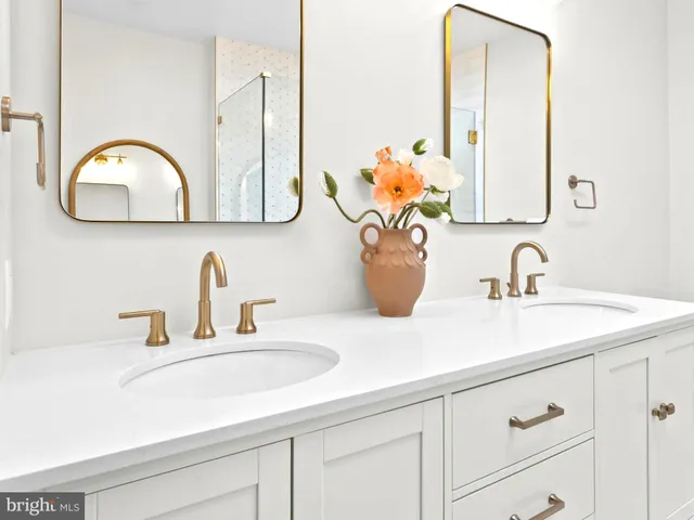 a kitchen with a stove a sink and a refrigerator