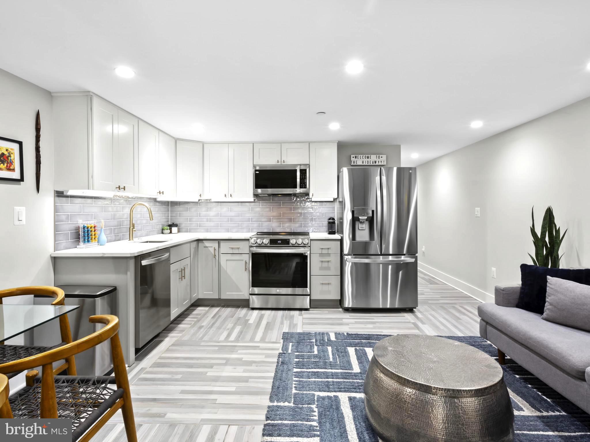 910 8th Street Northeast Washington, DC 20002 - Photo 37 of 54 a kitchen with a stove a sink and a refrigerator