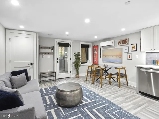 a bedroom with a bed and a potted plant