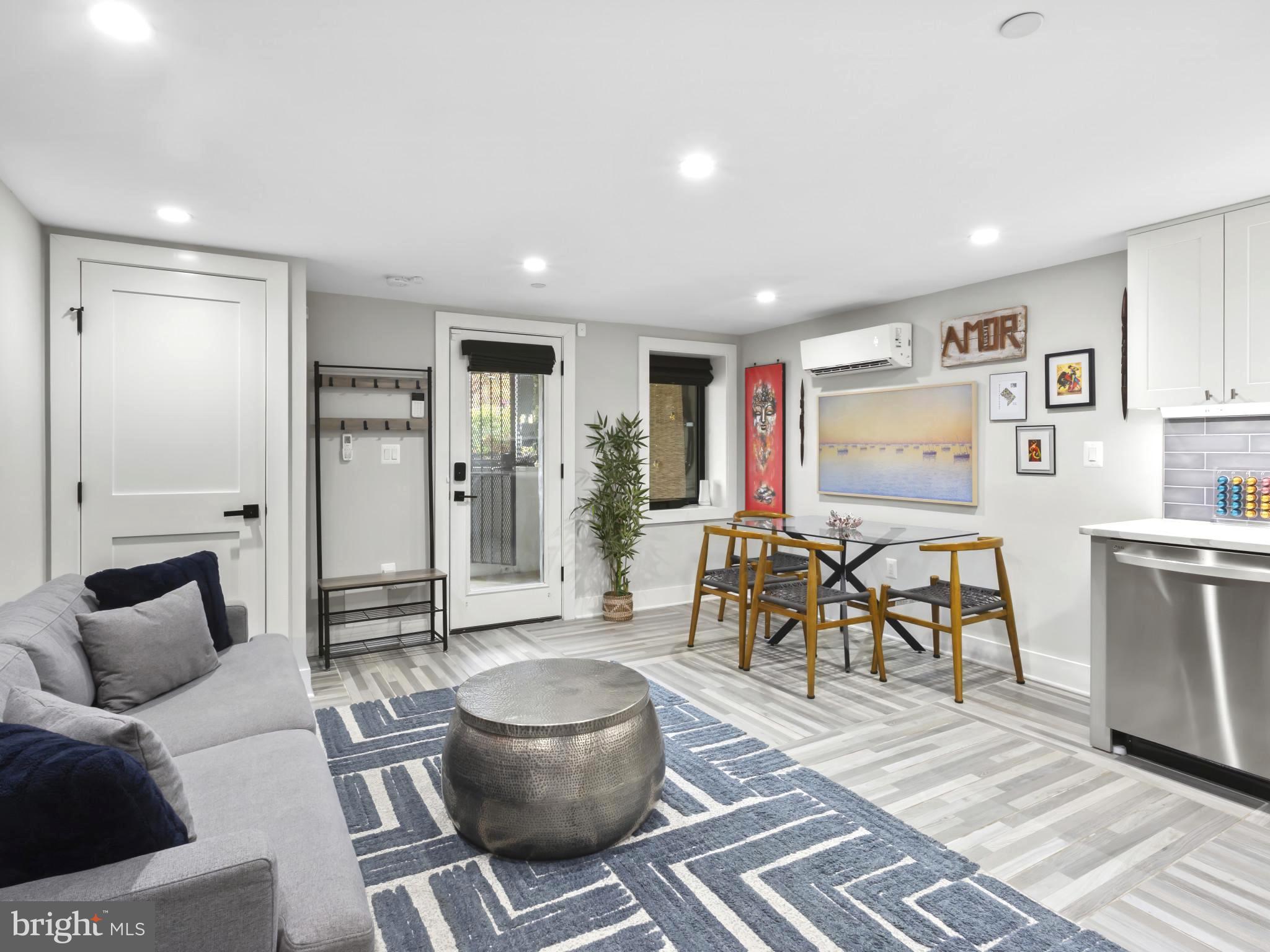 910 8th Street Northeast Washington, DC 20002 - Photo 38 of 54 a living room with furniture and a table
