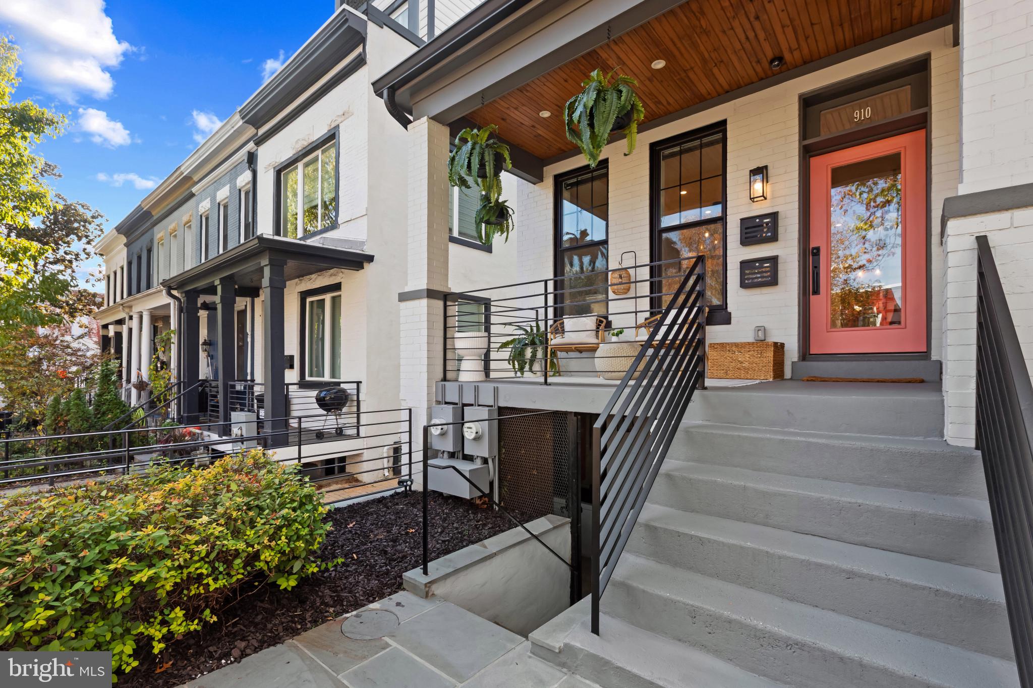 910 8th Street Northeast Washington, DC 20002 - Photo 4 of 54 a view of a house with many windows and plants