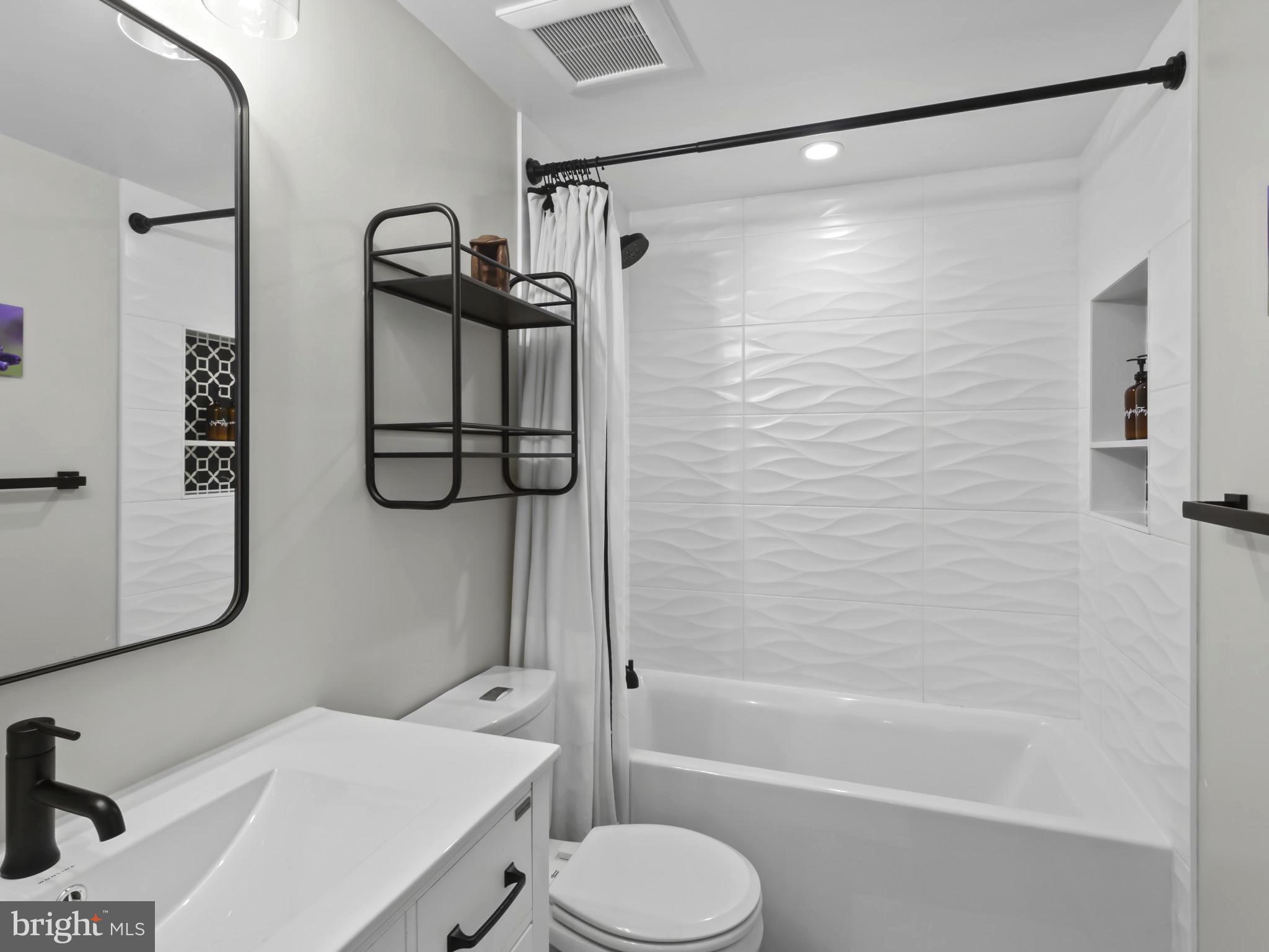 910 8th Street Northeast Washington, DC 20002 - Photo 44 of 54 a bathroom with a shower a toilet and a shower