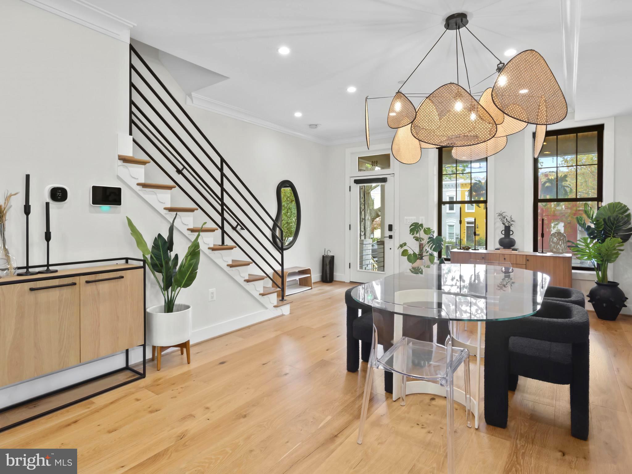910 8th Street Northeast Washington, DC 20002 - Photo 6 of 54 a view of a dining room with furniture wooden floor and chandelier