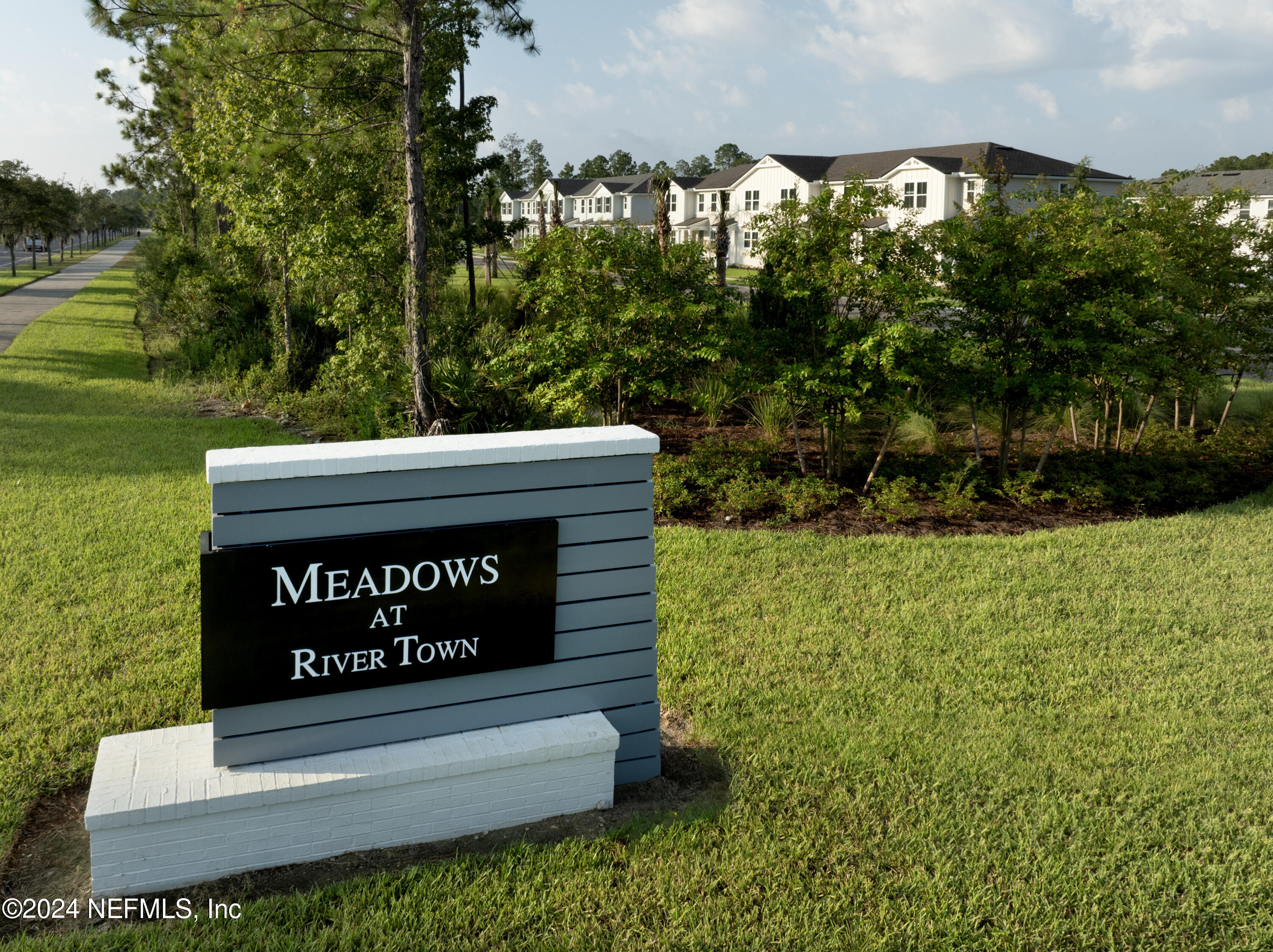 64 Cordelle Street St. Johns, FL 32259 - Photo 4 of 58 a sign of golf club on a wall under a tree