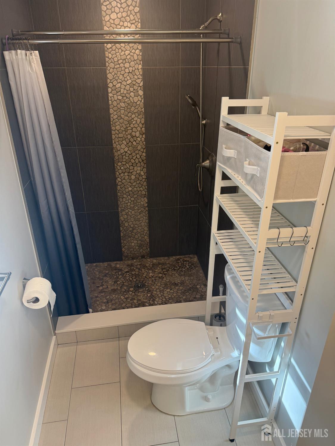 566 Ticetown Road Old Bridge, NJ 08857 - Photo 11 of 23 a bathroom with a toilet and a shower