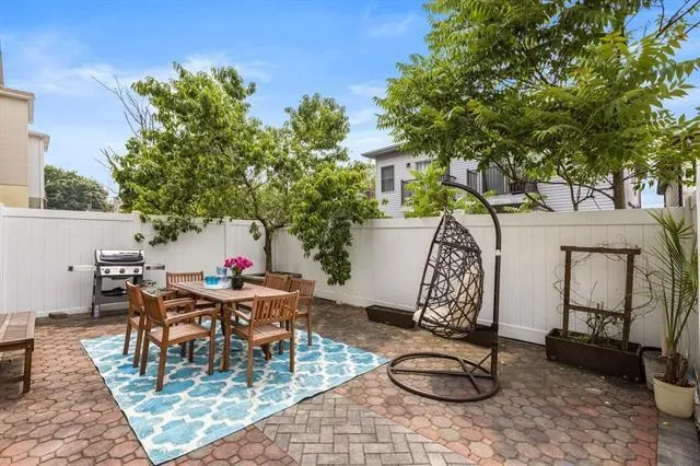 a outdoor space with furniture and umbrella