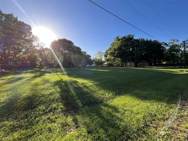 a view of a golf course with a lake