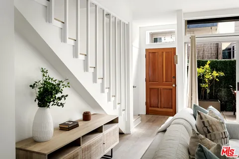 a view of a livingroom with furniture and entryway