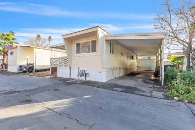 a view of a house with a road