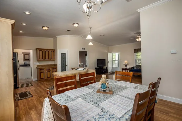 a living room with fireplace furniture and a wooden floor