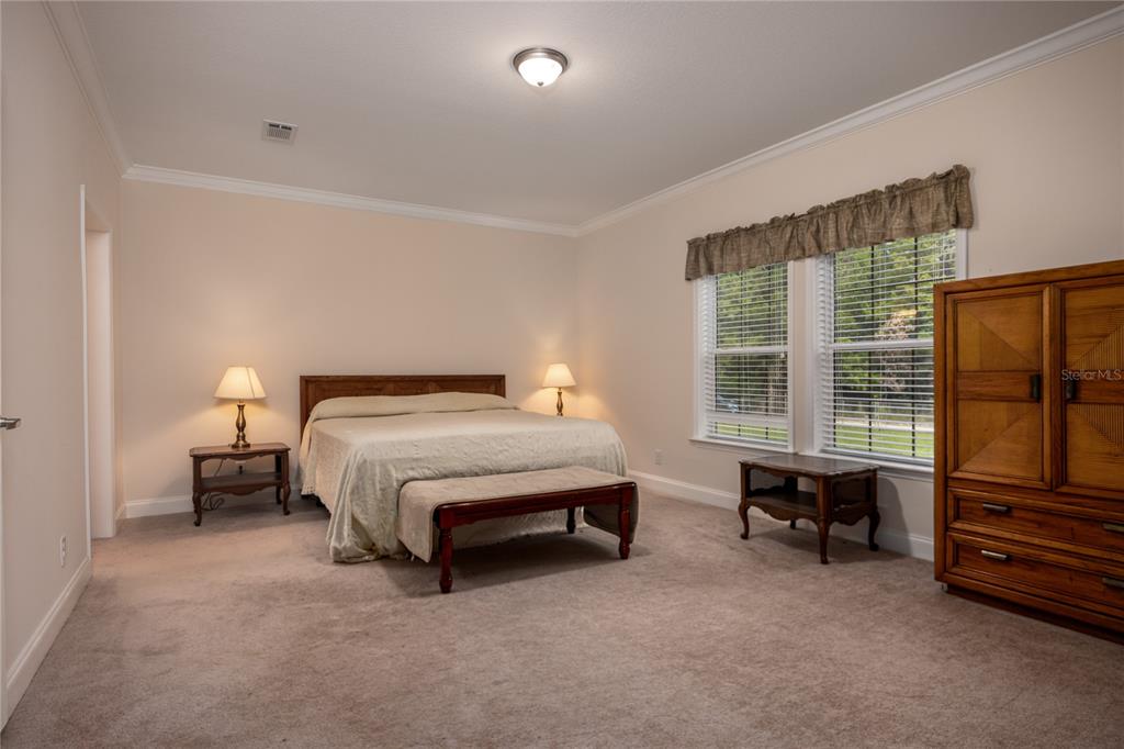 1759 Northeast 127th Street Branford, FL 32008 - Photo 18 of 45 a bed room with a bed and a chair