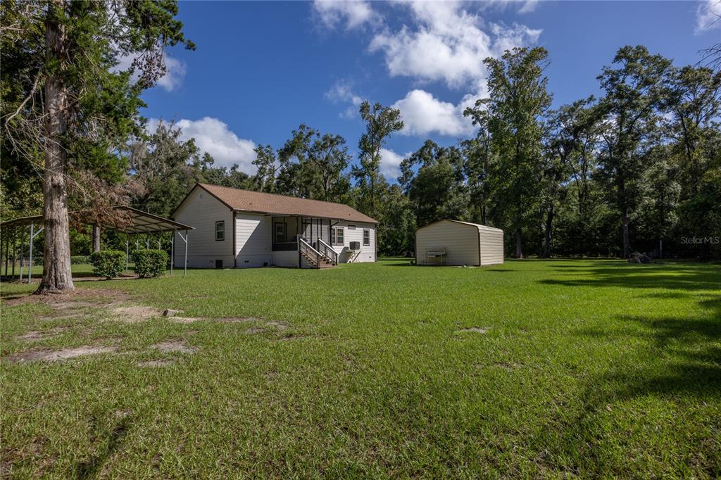 1759 Northeast 127th Street Branford, FL 32008 - Photo 40 of 45 a front view of house with yard and trees