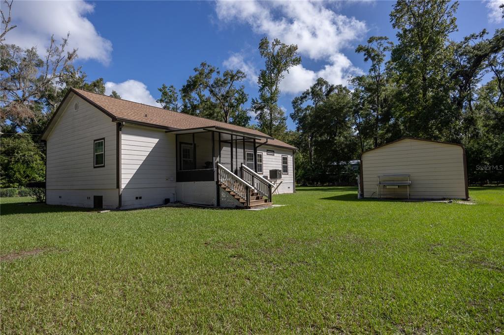 1759 Northeast 127th Street Branford, FL 32008 - Photo 41 of 45 a view of a house with backyard and garden