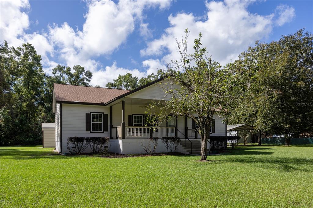 1759 Northeast 127th Street Branford, FL 32008 - Photo 42 of 45 a view of a house with a big yard and a large tree