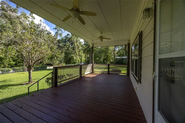 a view of a balcony with wooden floor