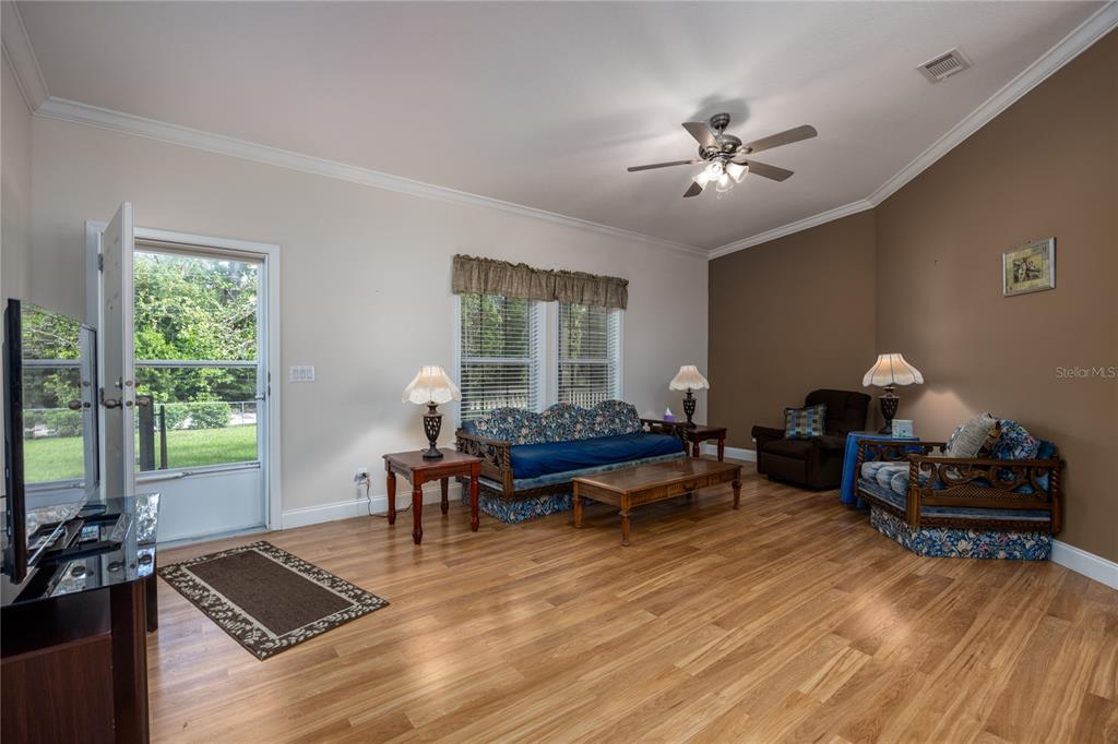 1759 Northeast 127th Street Branford, FL 32008 - Photo 5 of 45 a living room with furniture and wooden floor