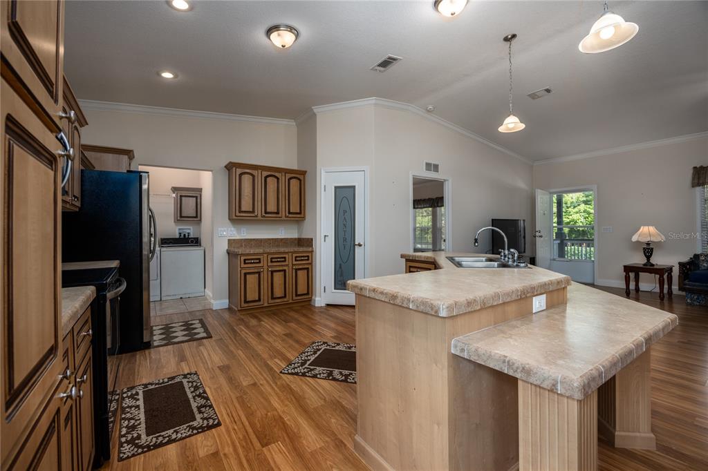 1759 Northeast 127th Street Branford, FL 32008 - Photo 9 of 45 a kitchen with stainless steel appliances granite countertop a stove and a refrigerator
