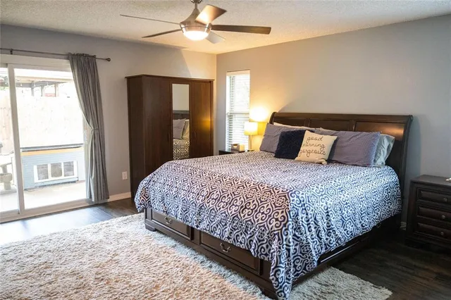 a bedroom with a large bed and a window