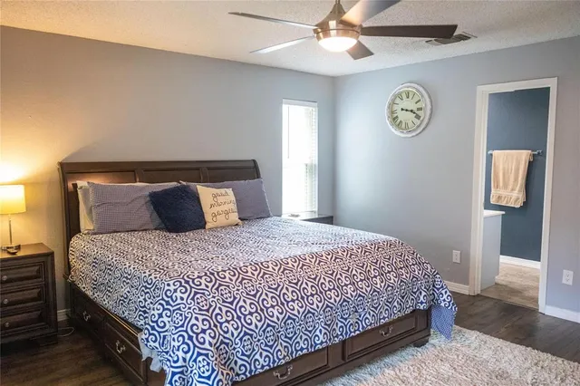 a bedroom with bed and a window